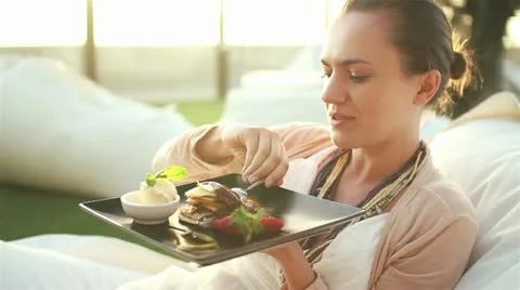 Happy woman eating sweet tasty dessert HD Stock Footage