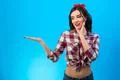 The happy woman gesturing on the blue background Photo