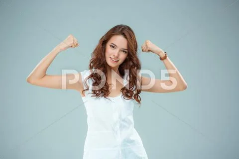 The happy woman on gray background Stock Photos