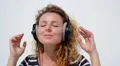 Happy Woman with Headphones Listening to Music. Slow Motion. HD Footage