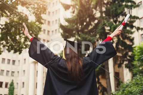 Happy woman on her graduation day at university Stock Photos