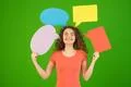 The happy woman hold a dialog signs on the green background Photo