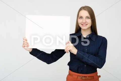 Happy woman holding white blank paper Stock Photos