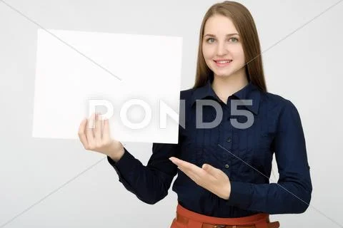 Happy woman holding white blank paper Stock Photos