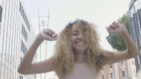 Happy woman jump to the camera's direction Stock Footage
