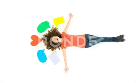 The happy woman lay and gesture near the dialog signs. View from above Stock Photos