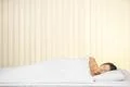 The happy woman lay on the bed Photo