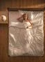 The happy woman lay on the bed. View from above Photo