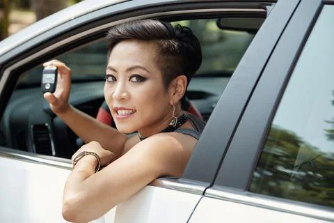 Happy woman in new car Stock Photos
