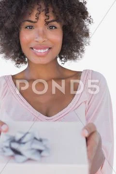 Happy woman offering a gift Stock Photos
