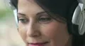 happy woman open and close eyes while listens to music HD Footage