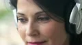 happy woman open and close eyes while listens to music HD Footage