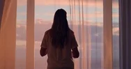 Happy Woman Opening Curtain Enjoying Early Morning Sunrise At Home Feeling Stock Footage