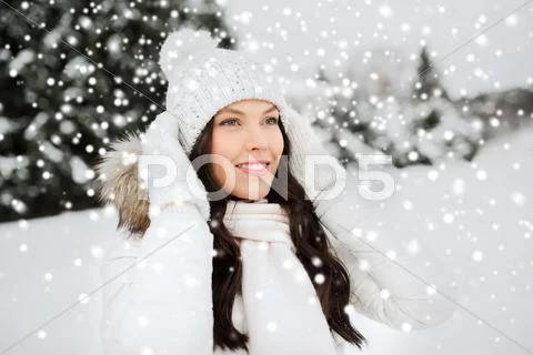 Happy woman outdoors in winter clothes Stock Photos