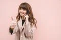 The happy woman phone on the pink wall background Photo