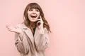 The happy woman phone on the pink wall background Photo