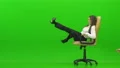 The happy woman playing on the office chair on the green background 4k or 4k+ Resolution