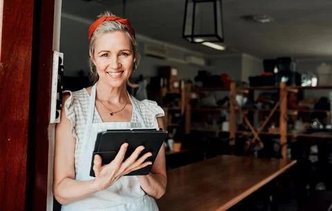 Happy woman, portrait smile and tablet in small business confidence at entrance Stock Photos