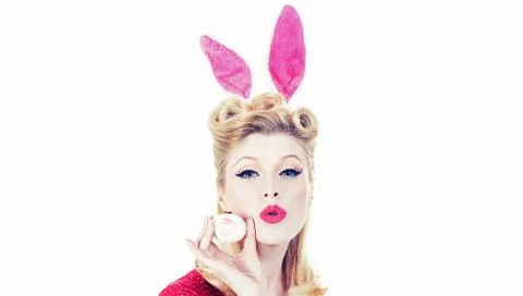 Happy woman preparing for Easter. Easter egg hunting. Pretty girl hunts for Stock Photos