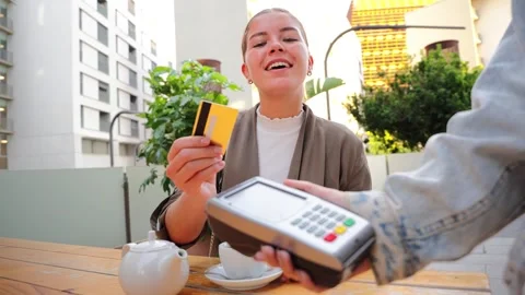 Happy woman processing a payment with her credit card Stock Footage 309232835