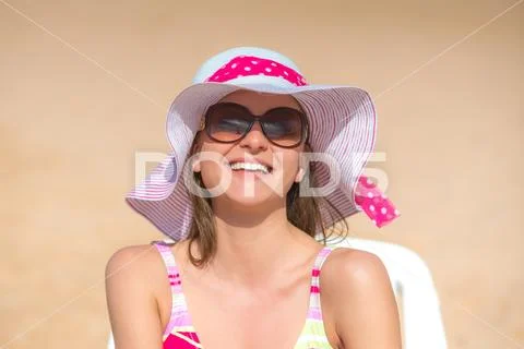 The happy woman rest on the beach Stock Photos