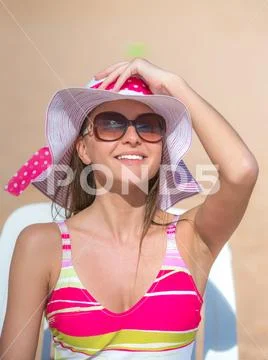 The happy woman rest on the beach Stock Photos
