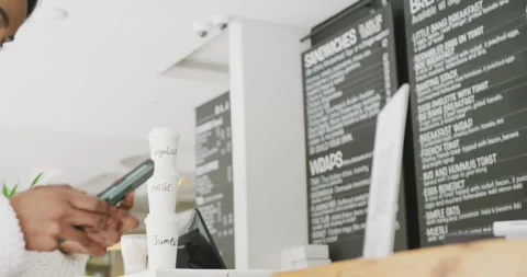 Happy woman scanning qr code with smartphone in cafe 스톡 동영상 343836508