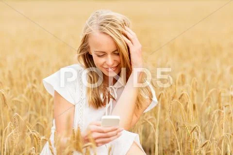 Happy woman with smartphone and earphones Stock Photos