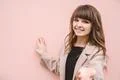 The happy woman stand on the pink wall background Photo
