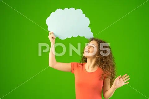 The happy woman stand with a virtual dialog on the green background Stock Photos