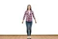 The happy woman standing on the white wall background Photo