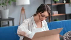 man unboxing cardboard box Tiffany & Co., Stock Video