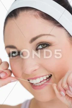 Happy woman using dental floss Stock Photos