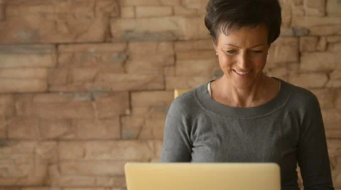 Happy woman using laptop computer Stock Footage 68630628