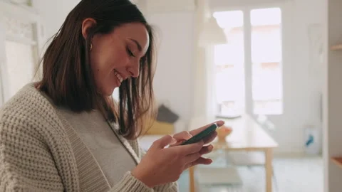 Happy Woman Using Mobile Phone At Home Stock Footage 301463085