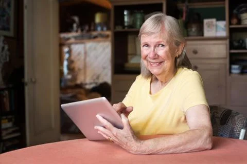Happy woman using tablet computer Stock Photos