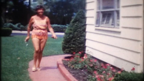 Happy women dance for the camera in the backyard  1950s vintage home movie  3967 Stock Footage 71473274
