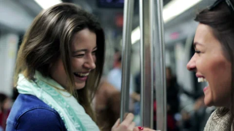 Happy women talking and smiling in subway, steadycam, shot. Stock Footage