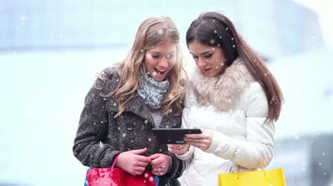 Happy women using a digital tablet Stock Footage 24672366