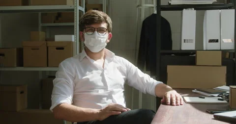 Happy worker of storage sitting and smiling, employee of warehouse wearing Stock Footage 157369932