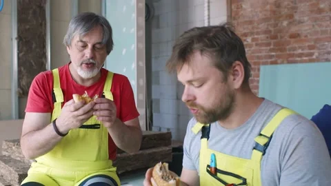Happy Workers On Construction Site During Lunch Break Stock Footage 133639090