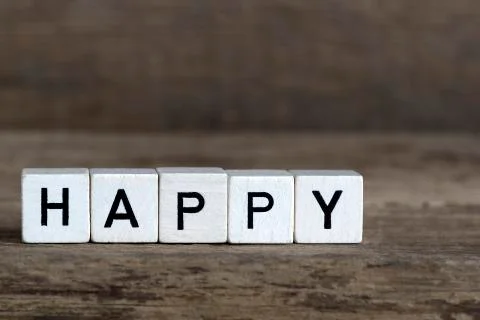 Happy, written in cubes Stock Photos