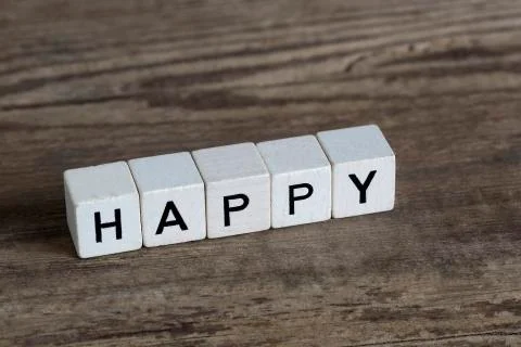 Happy, written in cubes Stock Photos