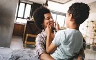 Happy Young African American Mother Having Fun With Her Child Stock Photos