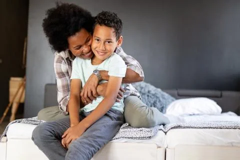Happy young african american mother having fun with her child Stock Photos