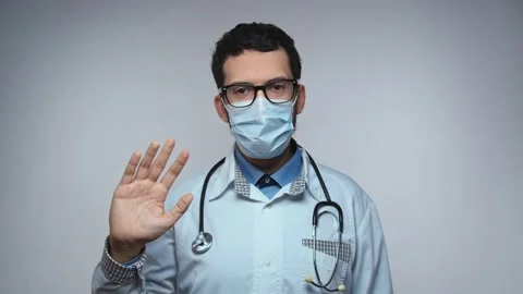 Happy young Arabic bearded man doctor waving hand Stock Footage 155690022