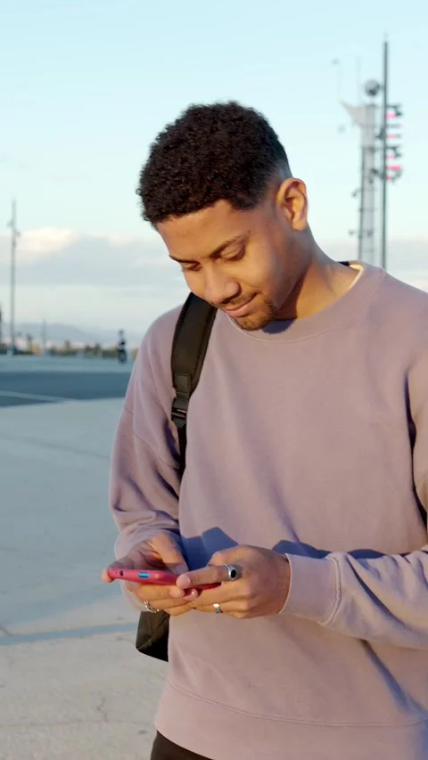 Happy young arabic man using cellphone outdoors. Stock Footage 240430922