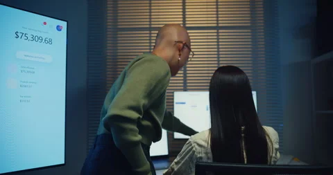 Happy young Asian co-worker team smile and brainstorm together in office night. Stock Footage 340908695