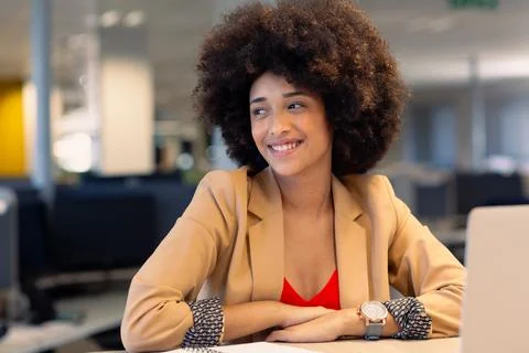 Happy young beautiful female african american advisor with afro hairstyle Stock Photos