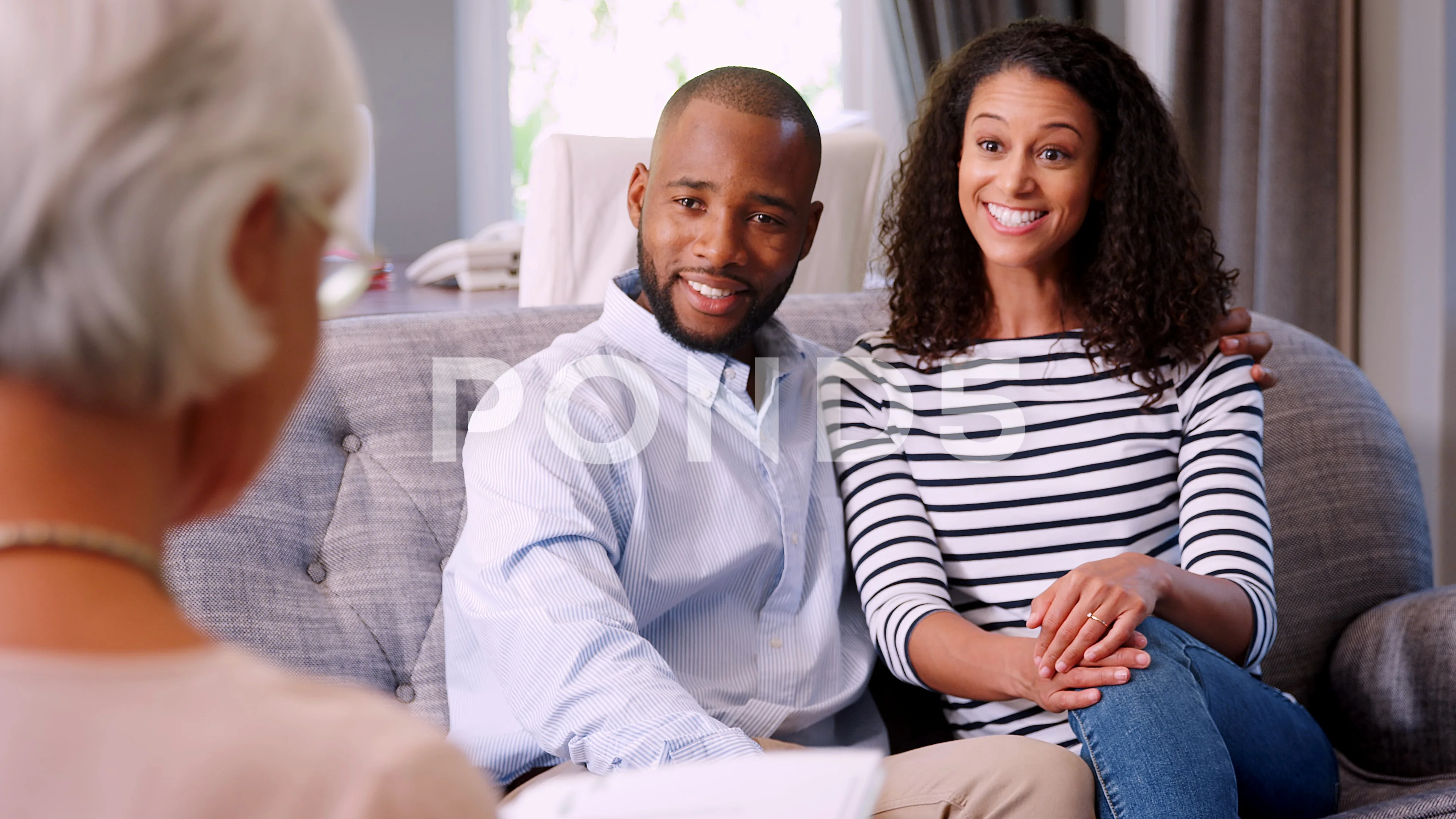 Happy young black couple in a meeting with financial advisor